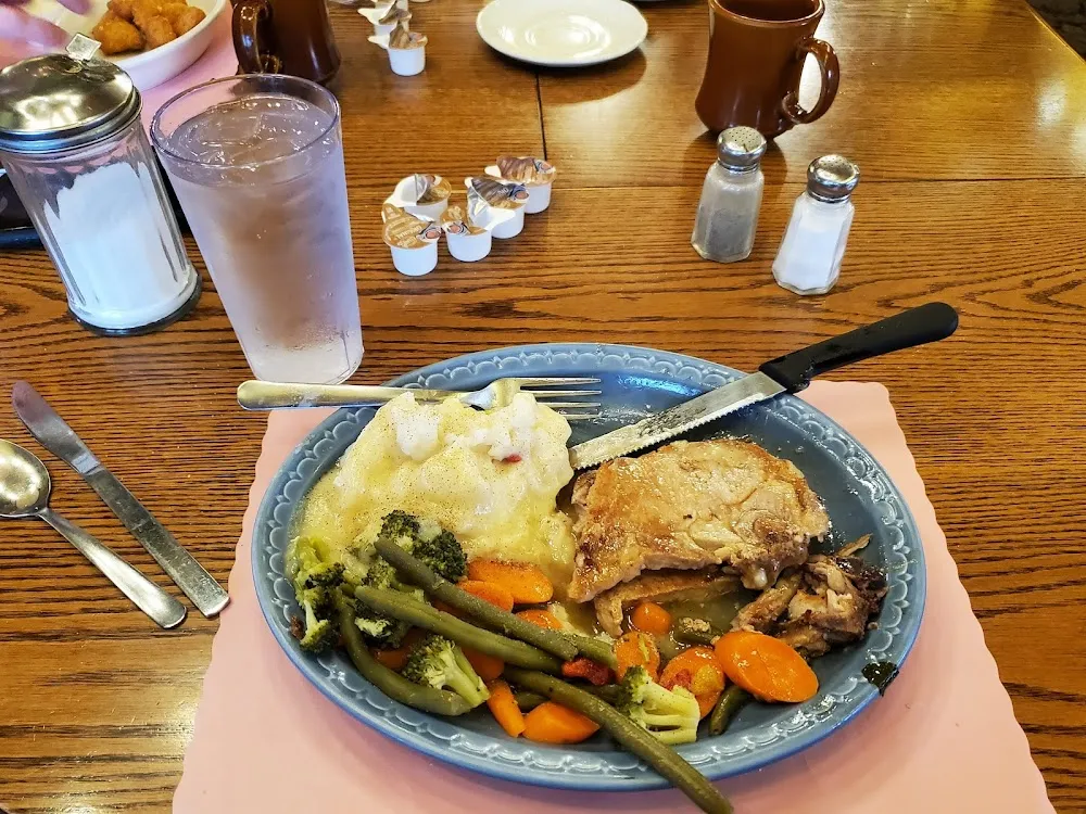 Pork Chops with Mashed Potatoes and Mixed Vegetables